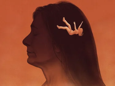 Silhouette portrait of a woman against a warm sunset background